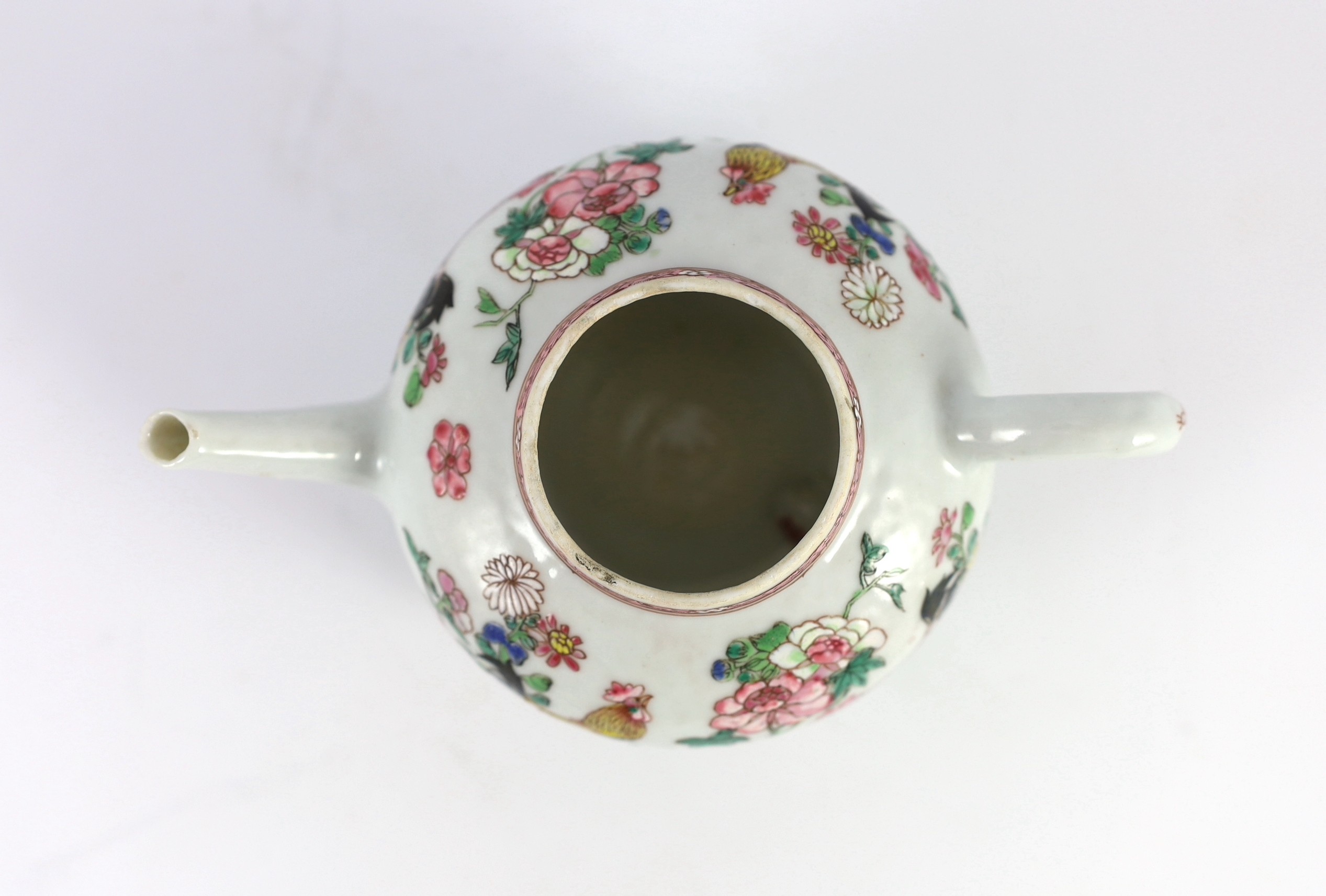 A Chinese famille rose chrysanthemum moulded teapot, early Qianlong period, painted with a cockerel amongst flowers, on a cage work base, 10 cms high